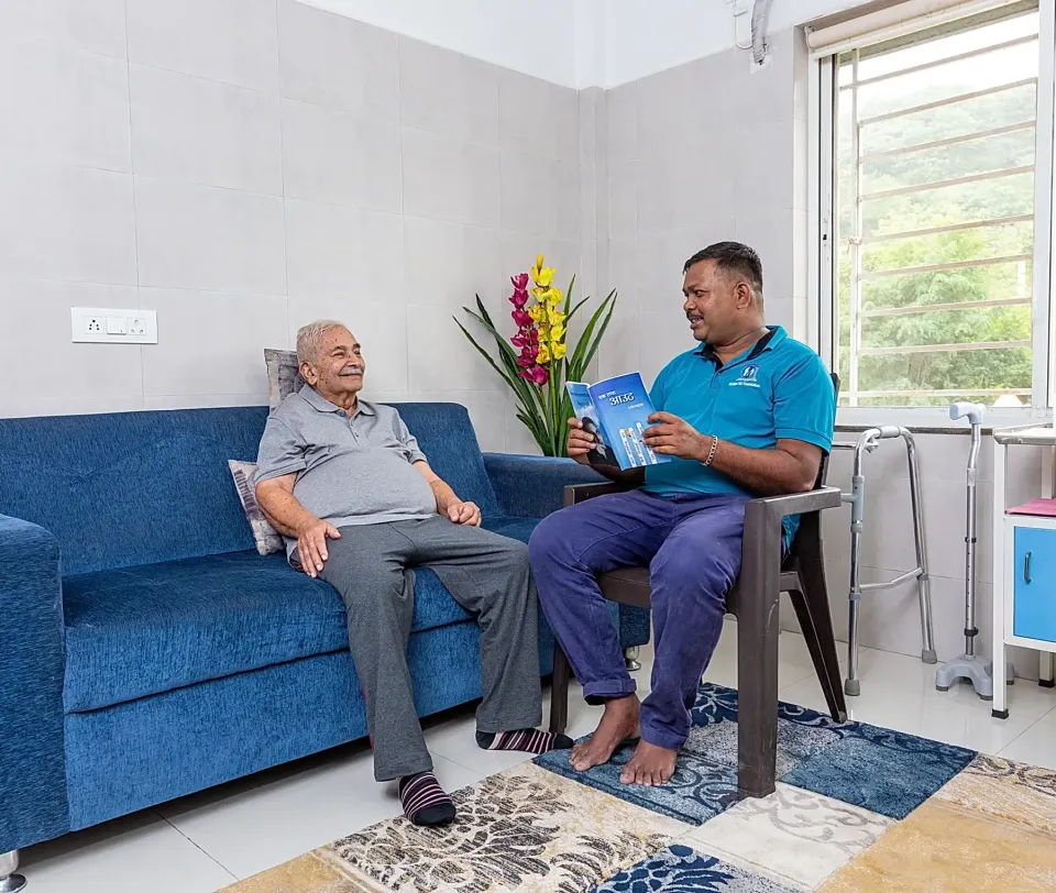 Senior resident smiling warmly in our cheerful living space
